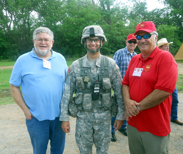 Reunion Photos - Jerry Orr
Field training observers: L to R - Steve Sykora and Mike Kurtgis standing next to a soldier in full web gear...modern-day web gear, that is.
