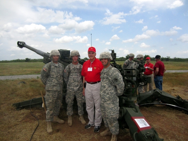 Reunion Photos - Wayne Crochet
Do you see another "odd man out"?   Well, his red shirt kinda stands out a bit.  Wayne mingles with the gun crew at the field firing demo.   Wayne refers to this shot as "An Old XO with a new M777 gun".
