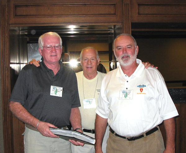 Hospitality Suite
HISTORIC MOMENT of the reunion: Bob Marley and Dick Arnold (right) had been "in-country" for just a few days when they got into a major battle.  Don Keith (FO in center) was directing artillery, jet aircraft strafing, and napalm sorties in the battle.  It was the first time these three men met since Vietnam.
