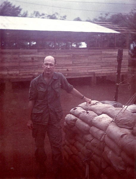 Here I Am!
Yep...that's me.  Sp6 Bob McLaughlin...I was the Mess Sergeant (Forward) for Headquarters Service Battery, 2/9th, at LZ Oasis.  Behind me is a sea hut.  The sea hut is temporary housing that was soon turned over to the South Vietnamese Army as our presence was winding down.
