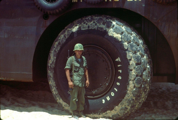 A "Duck"
Sgt Earl Rule stands next to the wheel of a duck.  Size differential is remarkable.
