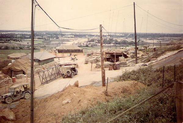 New FDC Section bunker
Feb/Mar 1968.  Taken from front of new FDC to Bde CP.  Bunker complex (w/ antennas) was Bde TOC bunker and we worked in it with them.
