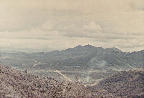 Highway 19
Hills protect either side of the Mang Yang Pass.  In the center, Highway 19 leads to An Khe - Qui Nhon.
Picture taken from atop the Pass.
