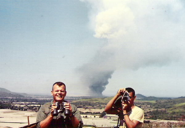 Division Ammo Dump Fire on South China Sea
Capt Mike Casp, Btry CO and Lt Dennis Dauphin, XO have a 3200 mil problem.  The fire is behind them.
