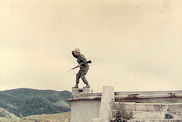 Armed & Dangerous
FO for A/2/35 clowns for a photo atop an concrete water tank at the Mang Yang Pass.
