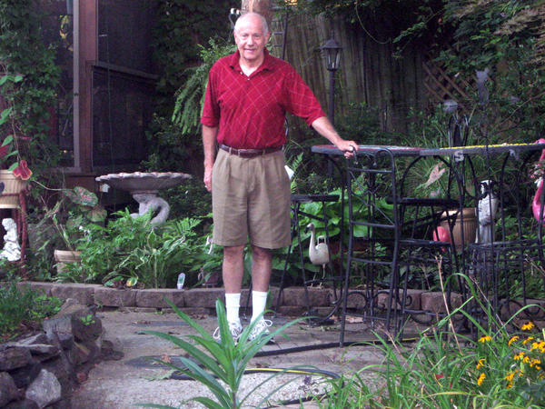 Don, wearing his traditional "artillery red" shirt, beckons you to visit his backyard.  One might say it is his "new Vietnam".  Lotsa work went into this tremendous transformation of a simple backyard to a small jungle.
