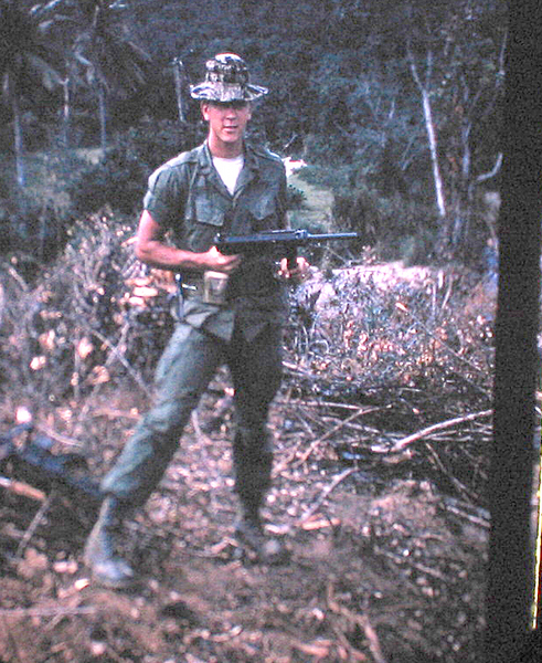 Ed's Arsenal
Lt Ed Thomas holding a "grease" gun
