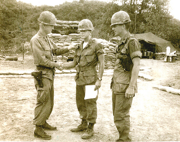 Getting an "Atta Boy"
Date: 21 Feb 67.   2/9th FA BnCo LtCol Bruce Holbrook congratulates Lt Ed Thomas and Lt Bill Farmer (later KIA) on their promotions to the grade of First Lieutenants.  The 2nd Lts felt a sigh of relief.
