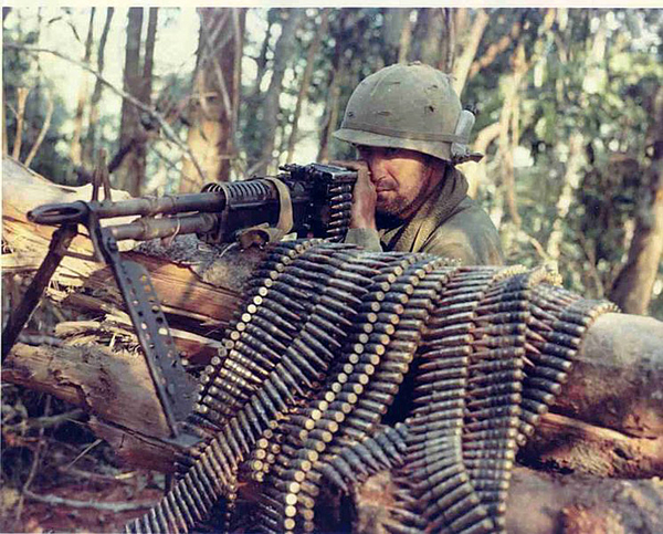 Loaded
UNK soldier ready to fire M60 with belts of ammo.
