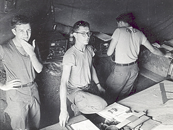 "It Went Somewhere"
UNK, Lt Kermit DeVaughn, FDO, "A" Btry, UNK (Ortiz?). The "boys" in the FDC look a little puzzled.
Lt DeVaughn (center) was the man who conceived the idea of a 2-CONEX container FDC, totally transportable by air and ready for immediate firing operations. Virtually all firing units adopted the idea. 
