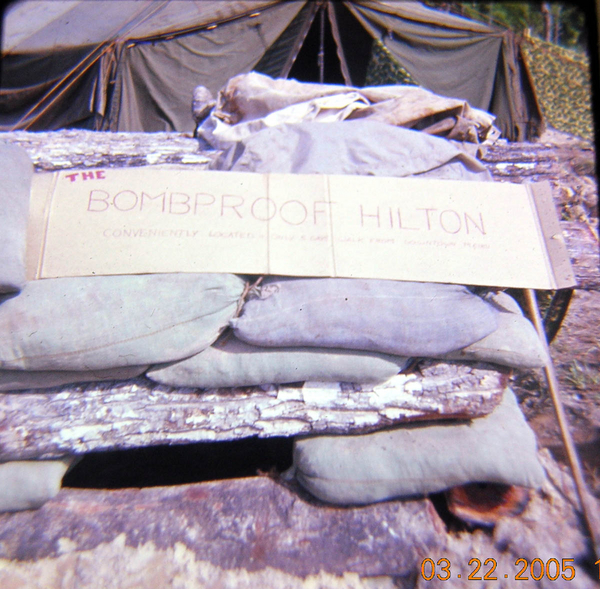 War Zone humor
The sign reads: "The Bombproof Hilton".  Underneath it reads "Conveniently located..." before the print fades.

