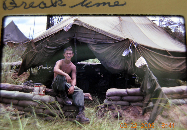 Break Time
Cleaned my mess kit and my uniform.  Taking a break.  (Note that short wall of sandbags around the tent.  That concept quickly dumped in favor of bunkers as time went by.)
