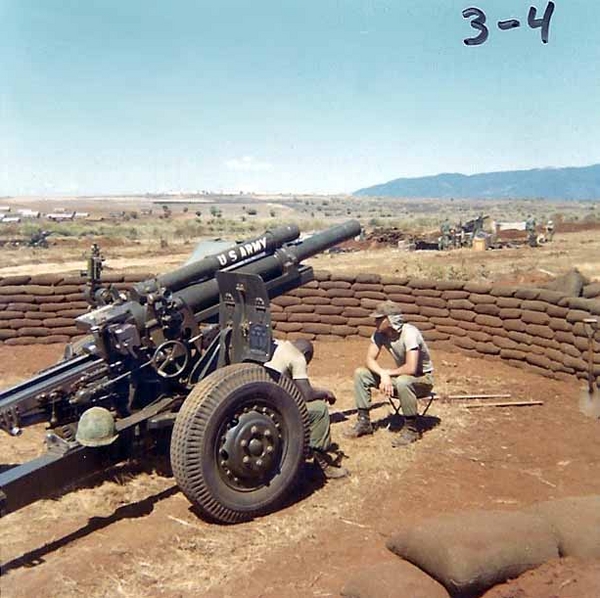 March, 1966
Gun Section emplacement, March 1966.  Note the very neat circle of sandbags.  You can tell this howitzer passed a "stateside" inspection before being shipped to Nam.  Note the "shield" is still on the right side.
