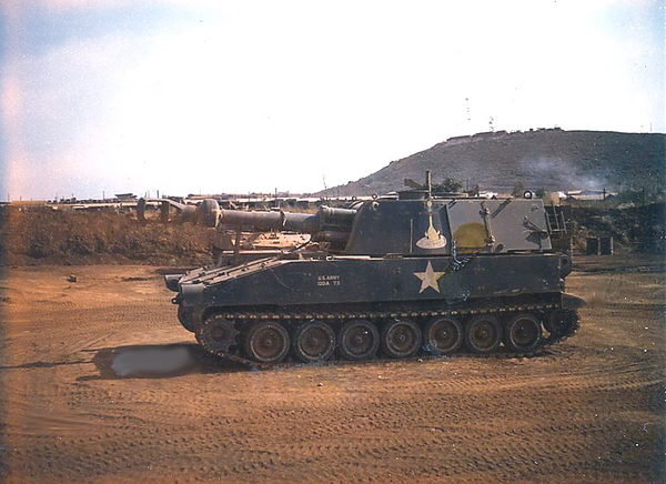155mm Self-Propelled
Taken when assisting another unit's commo group. They were on the far end of Montezuma from where 2/9th was.  This was a self-propelled) 155mm howitzer as it sat at Montezuma/Duc Pho. Taken with a Polaroid and an officer got bugged at me for taking it. I reminded him that I had top secret clearance and he got de-bugged. The marking above the white star is a cartoon of a duck sitting on a squashed egg.  Don't recall anymore what it said, but was quite humorous.
