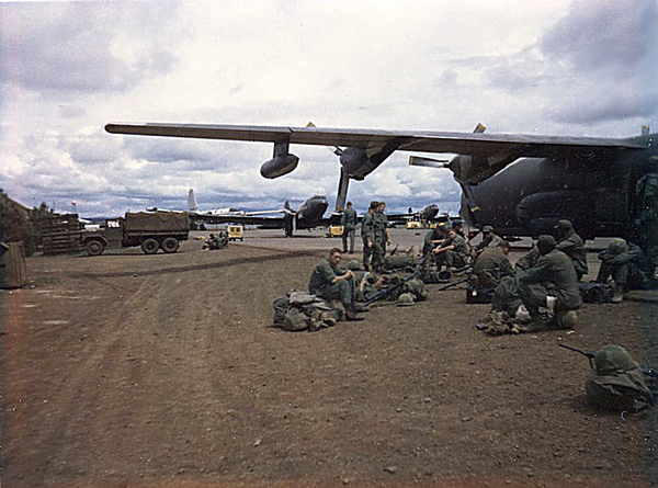 C-130
Here is a shot of one of the many, many, many times I was flying out on a C-130. Some of the guys on this very plane I never saw again. I heard they were later killed in an ambush. Note the DC-3-based "Puff The Magic Dragon plane in the background!

