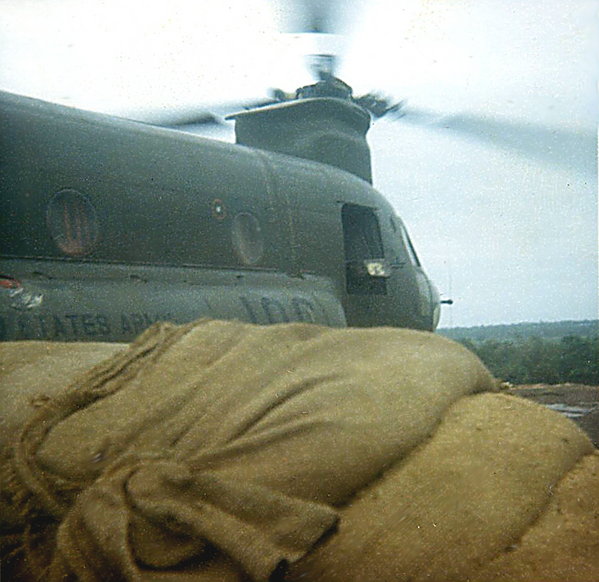 LZ English - Bong Son
Now, one day near the perimeter, this Chinook chopper lands, drops off a couple of things, then suddenly...see next photo....

