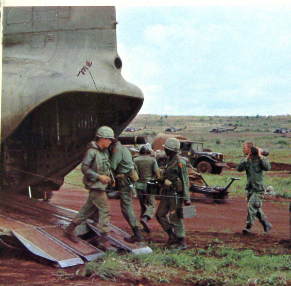 25th Div Yearbook - Oct 1, 1941 to Oct 1, 1966
Mike Huseth walking out of the back end of a Chinook.  Note the stateside fatigue work uniform instead of jungle fatigues.  The early worm got the bird.
