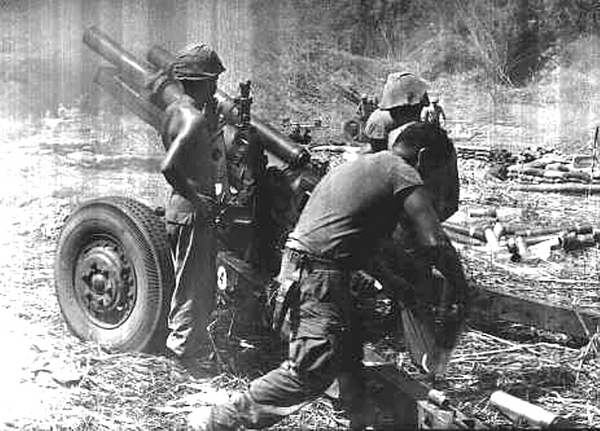 Fire Mission!
The men of "B" Battery work the howitzer on LZ Lane, just a couple of clicks from the Cambodian border and the site of many battles in Nov, 1967.
