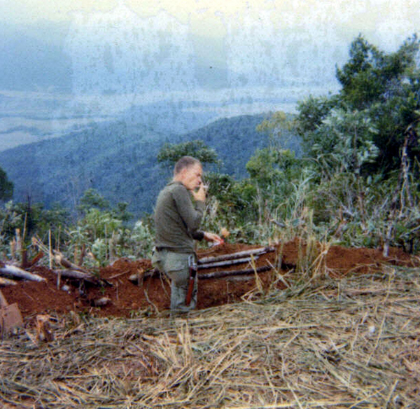 "Light 'em if ya got 'em!"
Capt Jerry Roberts, CO of B/1/14, (aka "Pilot", his call sign) takes a smoke break while checking out a defensive position.  We were later sent into the mountains you see in the background.

