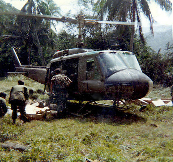 Combat Taxi
Everyone got used to ducking under the rotors.  This is the "palm grove" location where we stayed for a few days.

This is where Col Simko was killed when the pilot clipped a palm tree, lost his tail rotor and spun out of control, crashing to the ground.
