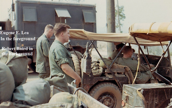 Ready to push?
PFC Eugene Lea in the foreground; Captain Robert Baird, ADA, in the background.  In case the jeep conks out, they gotta push it.

