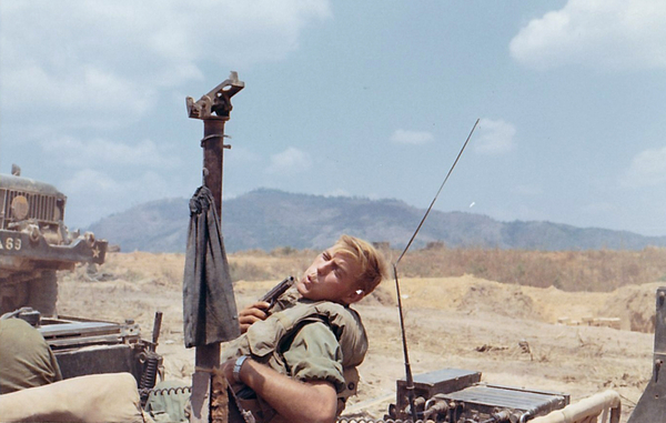 March, 1969
A Lieutenant with the 1/69th Armor (NOT the 2/9th!) clowns around with his pistol.  Photo taken while on the move to Kontum.
