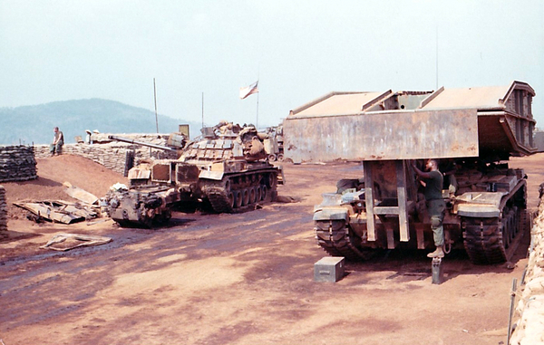 January, 1969.  A tank bridge and changing an engine on a tank (at left) at the 1/69th Armored.
