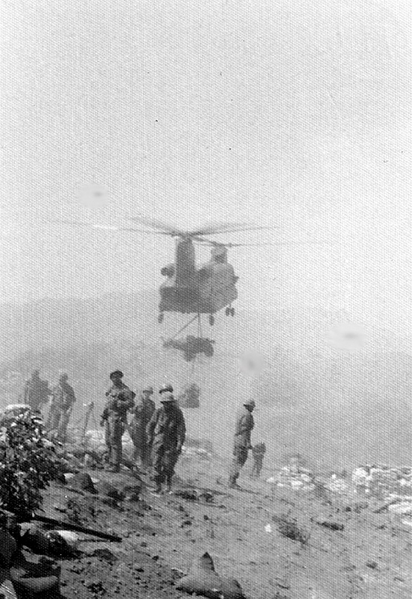 LZ Meade
"A" Battery just arriving by "shithook" (Chinook) on LZ Meade. We had just left the comparable "luxury" (?) of LZ English.  LZ Meade was dusty, dirty, and worst of all, rocky.  Could not fill a sandbag...too hard to dig.  Apparently we were not the first unit to occupy the hill as there was a lot of stuff left from previous tenants.  No ID's on the guys in the photo.
