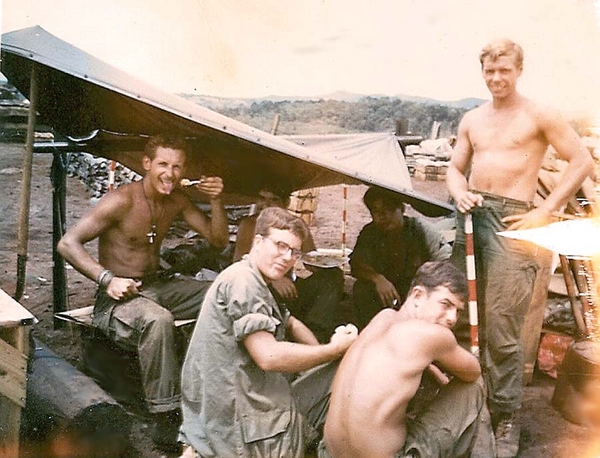 Chow!
Date: 7June68  Location: LZ Penny
Devouring C-ration stew.
L to R: Arab - Dog - Dink - Gary - Nauman
Practically everyone was known by a nickname.
