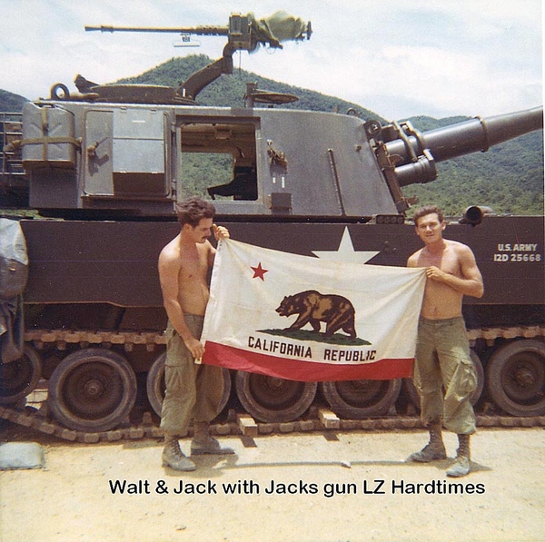 State Loyalty
Walt & Jack pose with California state flag in front of battle tank.
