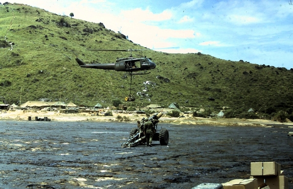 Early Days of Duc Pho - Spring, 1967
A Huey drops off supplies that go with the 155mm howitzer.  Don't think that the Huey can pick up the 155; it can't.
