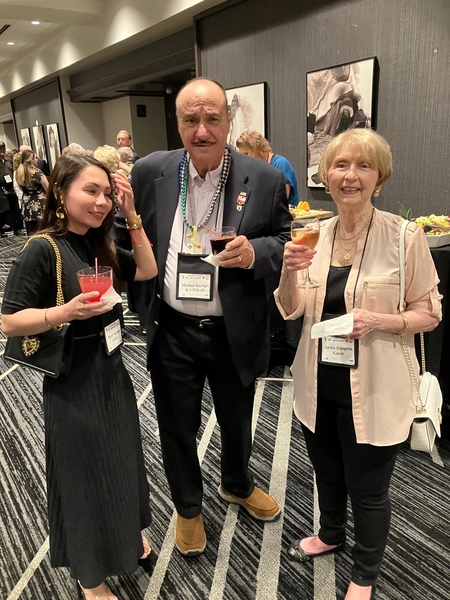 "Here's To You"
Lt Mike Kurtgis, an FO and helo pilot with the 2/9th FA, wife Mercy and Jackie Dauphin, lift their glasses in a toast at the "Happy Hour" prior to the Saturday Night banquet.
