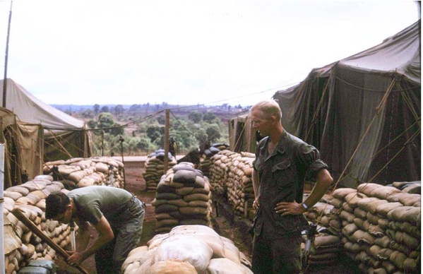 Watts & Coker
Ron Watts is at left (bending over) while SFC Clyde A. Roker supervises.  We had just left the 1/69th Armor at Ben Het around April, 1969.
