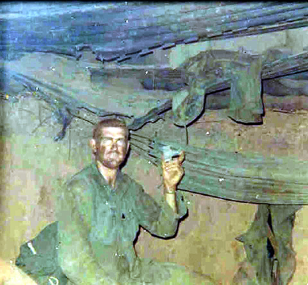 Aftermath
"Big Red" is holding a mortar tail that came through the roof of the bunker.  Sandy was WIA at that time.
