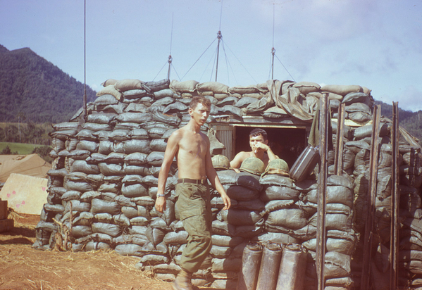 That Covered FDC
The sandbag-covered CONEX was the home of most FDCs.  Pictured above is Eldridge and John Severn at location unknown.
