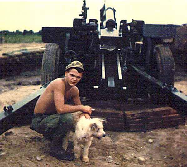 Sent to me by others
"Hillbilly" and canine friend behind one of the old split-trail 105mm.
