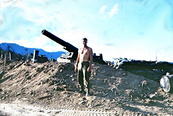 I'm here, Mom!
It's me, Fred!  FO J. Fred Oliver (assigned to 1/14th) stands in front of an 8" howitzer.  This gun helped save A/1/14 from some significant losses when they got out of range of both 105's and 155's.  I walked in one round at a time.  The rounds had to pass diagonally over our heads to hit target.  I can still hear the waffling racket the rounds made a second before they slammed into the hill above us.  I went back to personally thank the 8" crew for their accuracy.
