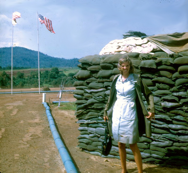 Compliments of Jenny Young
Donut Dollie Jenny Young shares some of her photographs taken while in Vietnam.  That's her in front of some sandbags that may need re-stacking.  Probably not at a 2/9th location.  But...it's a very good shot of a very attractive Donut Dolly!
