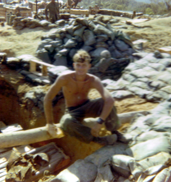 LZ Tuffy - 1970
My arrival at LZ Tuffy.  This is the FDC share of the big log with me sitting on it over a rubber lady.
