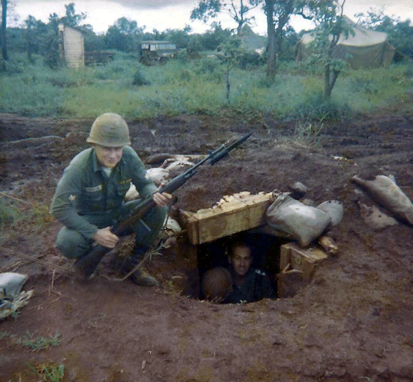 Hide and Seek
Fellow redlegs Barrington and Pfc Gordon G. Roufs.  Roufs came over from Hawaii with Operation Blue Light.
