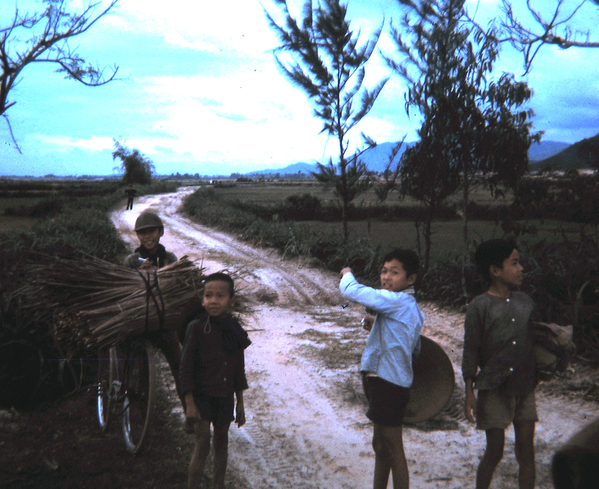 Ban Me Thout
Child giving directions?  He said, "Me no VC; VC go that way. Assisting US troops could prove dangerous.  Typical Vietnamese children in Ban Me Thout.
