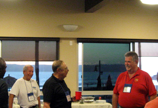 Our Host
Redleg Bert Landau, with cup in hand, welcomes TOC member Jim Connolly at the Friday evening party. To the left is the Co-Host of the party, Dave Collins, who commanded C-1-35 with Lt Bert Landau as his Forward Observer.  A very special event planned by Dave and Bert in a very upscale environment.  Weren't we fortunate!
