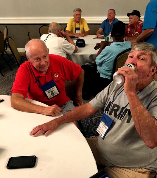 Getting prepared
Outgoing 35th Assn President Joe Henderson (right) knows he needs some "heavy refreshment" before listening to yet another great Don Keith "war story".
