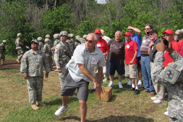 Reunion Photos - Danny Yates
Giving it the ol' "heave-ho".  During our basic training orientation of new soldiers on the record hand-grenade course on Thursday morning, the "old soldiers" were invited to try their hand at it.  The tennis-ball size training grenades contained a primer only and usually rolled a few feet after tossing...then you heard a "pop".
