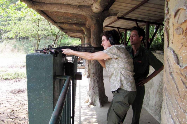 Vietnam: 2012 visit
M-16:  My wife squeezes off a few rounds from an M-16.  Note Vietnamese observer.
