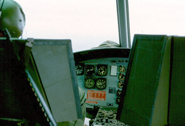 Helo Pilot's View
The controls of the helo as the pilot and co-pilot sees them.  Note that side panels were added to the pilot's seats to protect against enemy fire.
