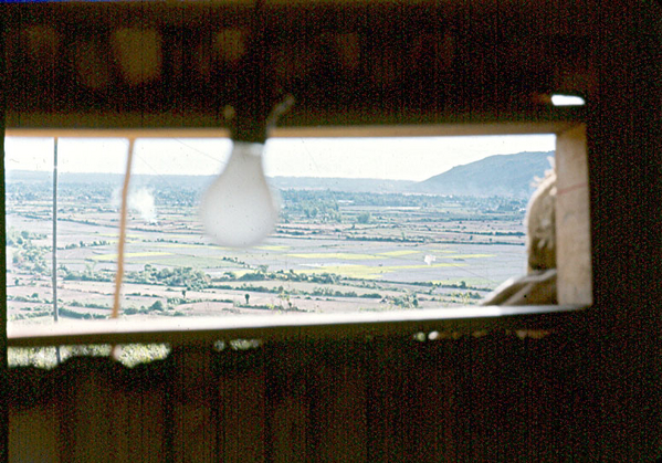 A Peek Outside
One of the "windows" cut out of the CONEX-FDC provides an excellent view of the rice paddies leading to LZ Montezuma.  Note the decorative light fixtures used in the FDC.  The wooden window casing doesn't quite match the welder's cut, but it was close enough.
