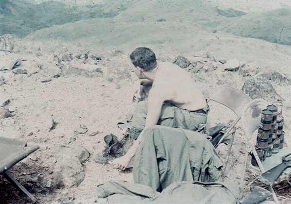 The Final Days
PFC Greg Malnar tends to some sore feet atop LZ Mile High at Tam Ky.  Greg was in the FDC and later served as an RTO with Lt Bert Landau.

