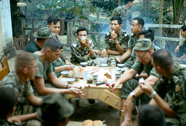 Vietnamese Marine Brigade
This is a picture of the  Commanding Officer and his staff of a Vietnamese Marine Brigade plus the American Marine advisors.  They were working in the 3rd Brigade, 25th Infantry’s AO for about a month and I was the 2/9th liaison officer with them.  My job was to keep our batteries advised of where they were operating and to coordinate any fire support they needed.  
