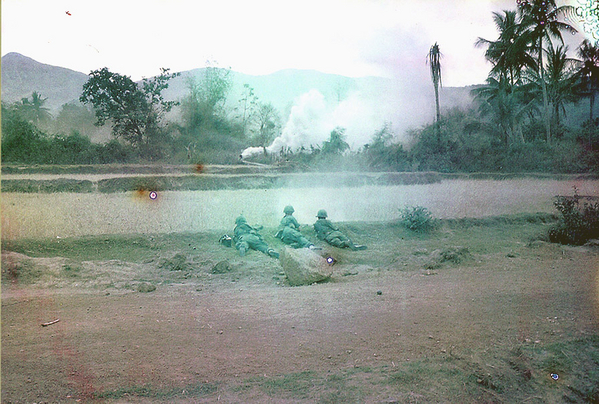 Firefight in progress.  The use of smoke grenades was critical in Vietnam.  It marked your position as well as marking where you wanted air support.  The 105mm artillery used smoke rounds to mark where the HE was going to fall after adjusting.
